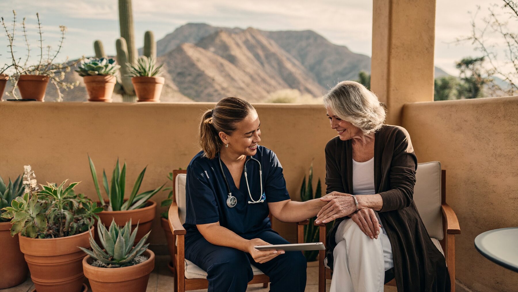 Nurse practitioner reviewing a care plan with a patient on an Arizona patio.